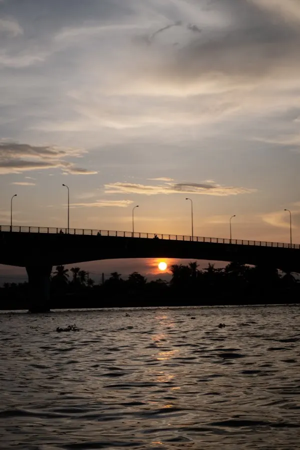 eSIM Can Tho Vietnam - floating market on the Mekong Delta with small wooden boats piled with tropical fruit and