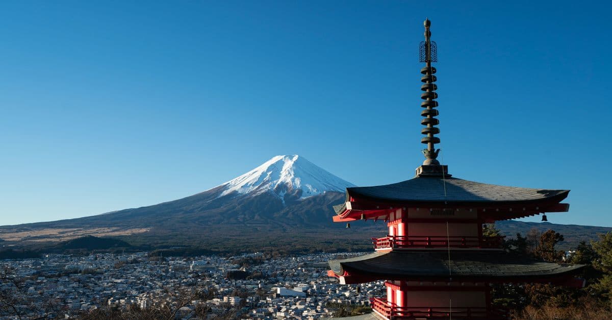 Chureito Pagoda framed by cherry blossoms with Mount Fuji backdrop, a highlight of a Japan holiday.