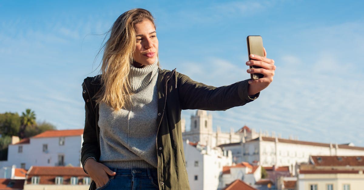 Young woman staying connected in Europe using a travel eSIM or local SIM card outdoors