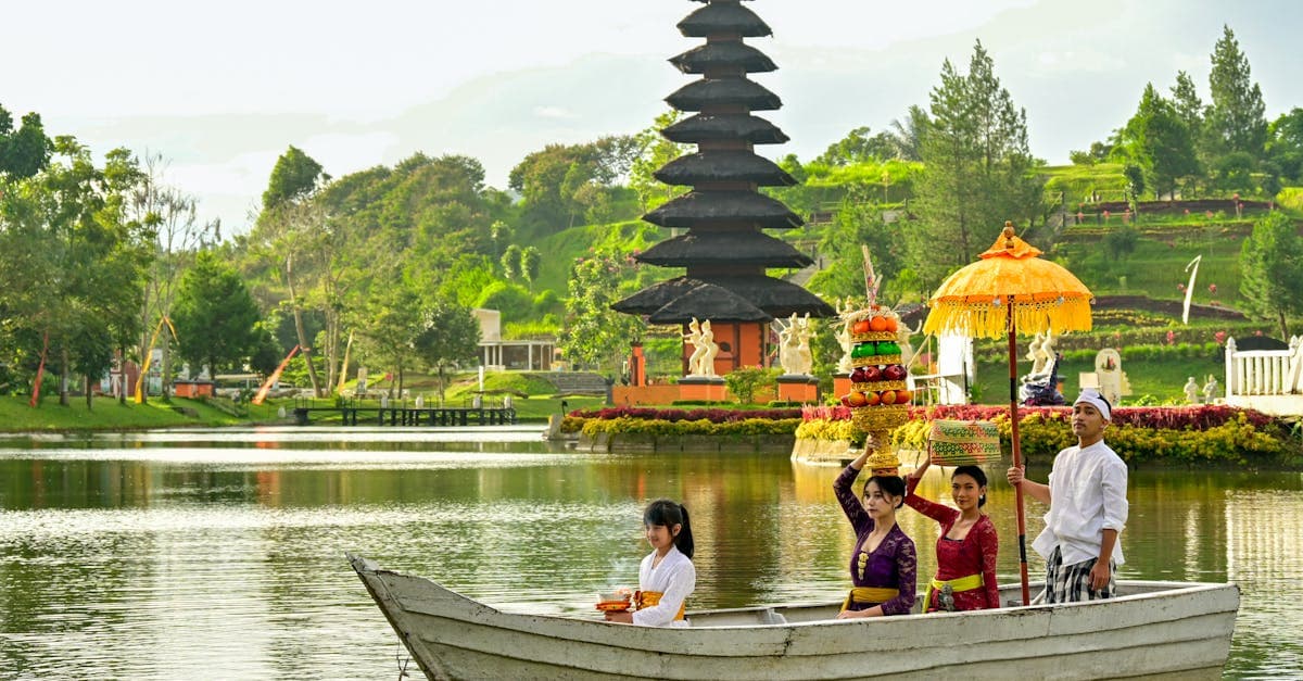 Traditional Balinese water temple ceremony with locals on a boat, capturing the cultural things to do in Bali