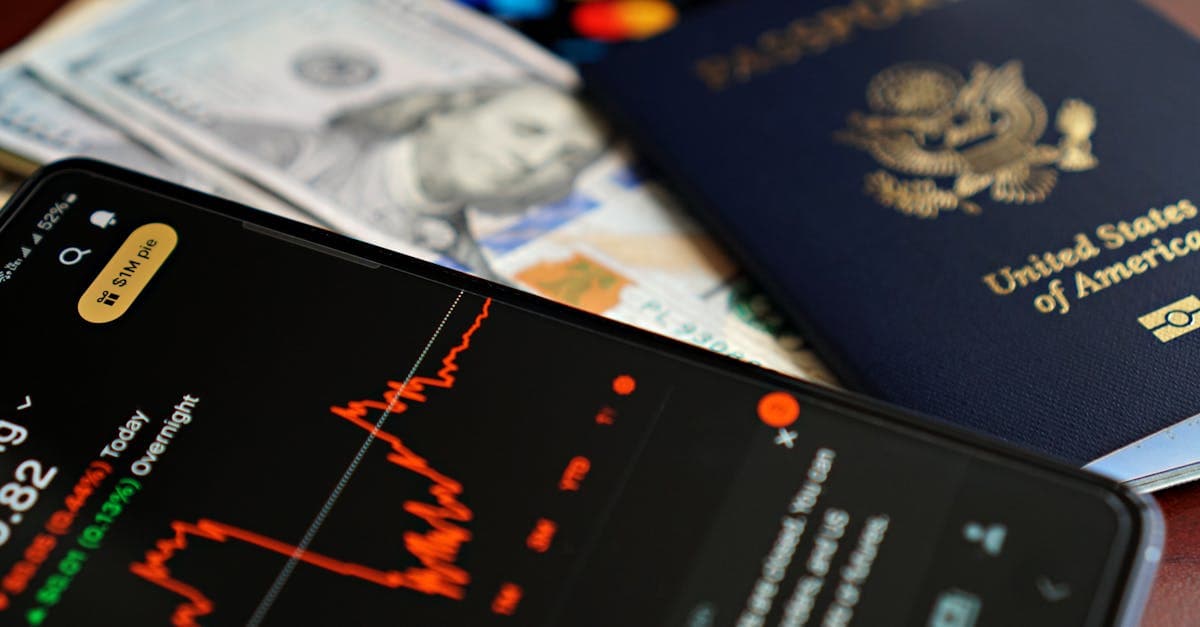 Smartphone, US passport, and cash on a table for planning data and connectivity on your first US trip