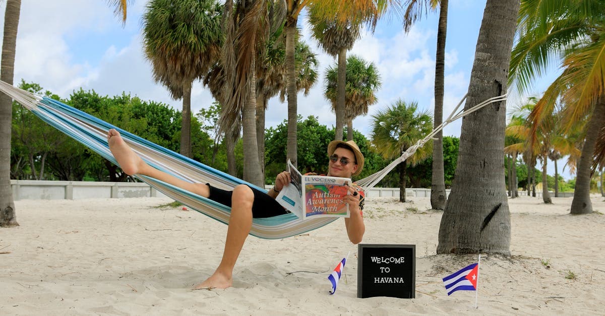 Man relaxing in a hammock on a palm-lined Havana beach, a classic Caribbean affordable vacation destination