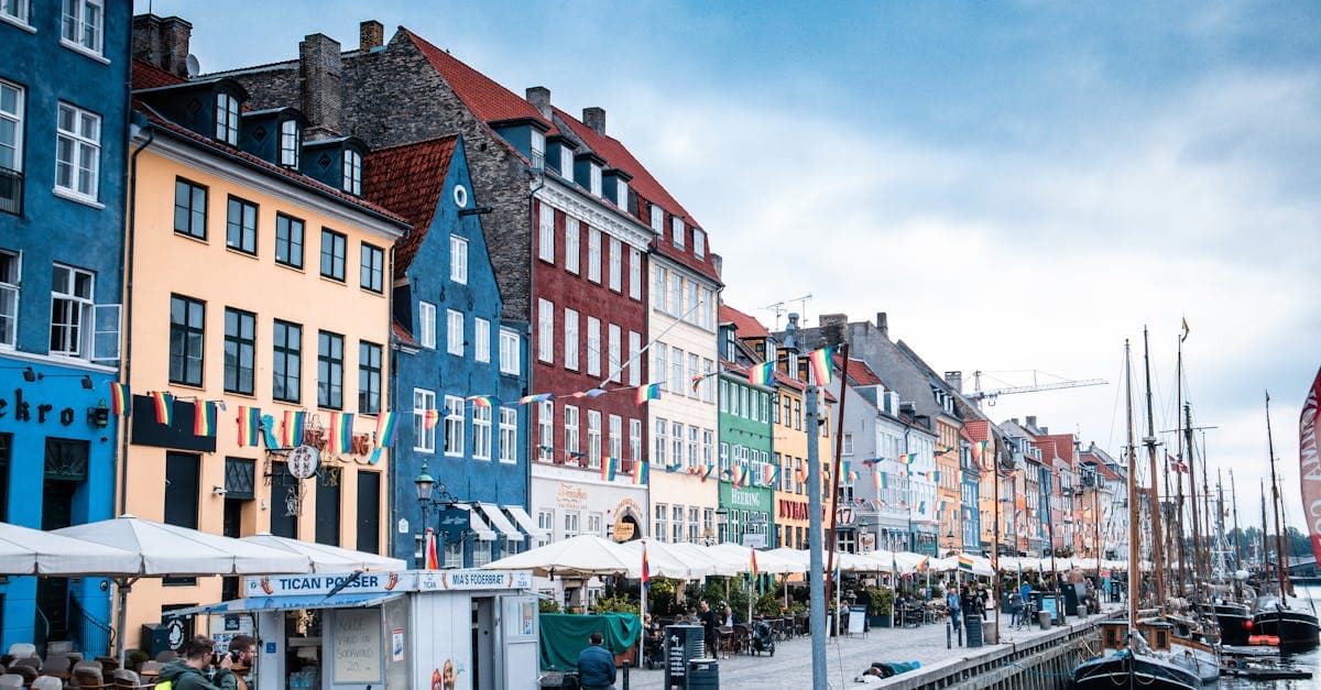 Colourful buildings and boats line Copenhagen's Nyhavn waterfront, one of Europe's most affordable vacation destinations