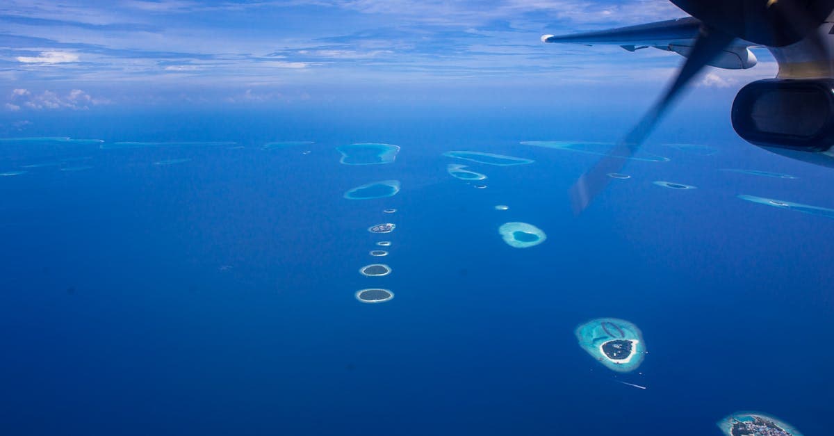 Aerial seaplane view of Maldives atolls, showing flight routes from South Africa for a Maldives holiday