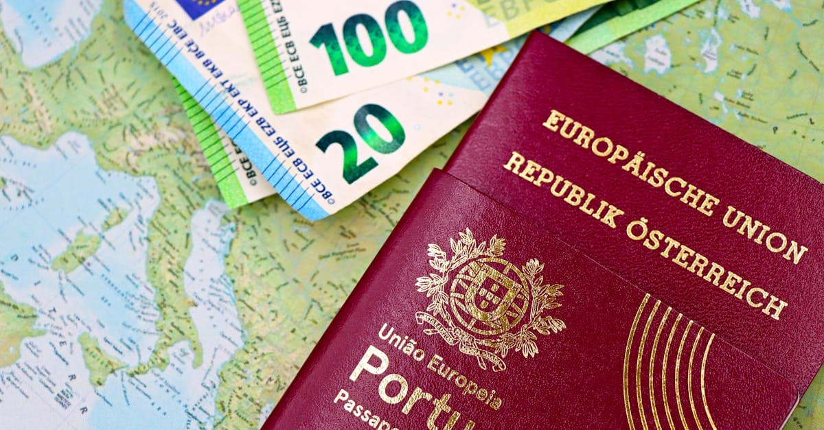 Portugal and Austria passports with euro currency notes spread on a European map for visa prep