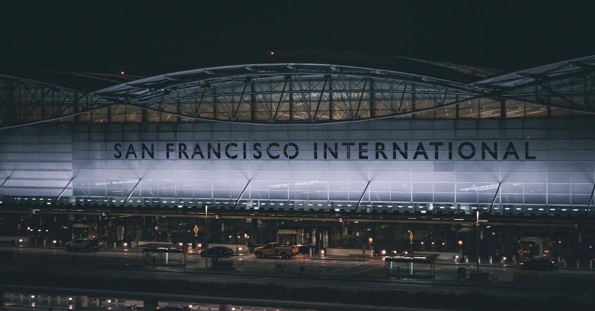 Dramatic nighttime view of the illuminated facade at San Francisco International Airport.