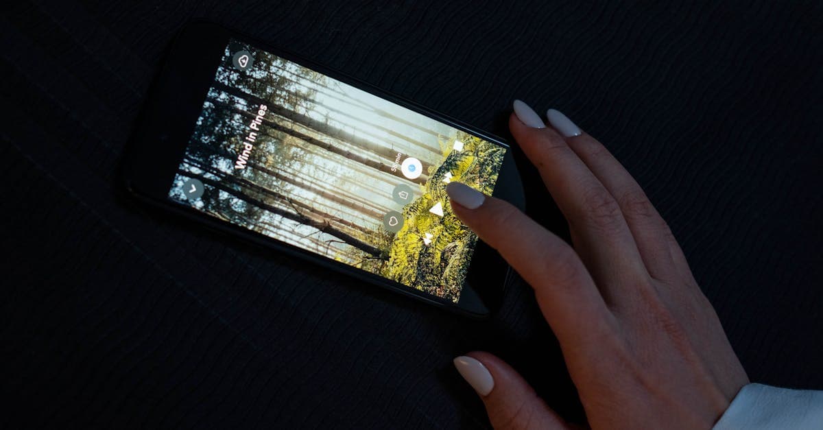 Hand interacting with a smartphone app, exploring whether the streameast app is legal to use in Canada.![image