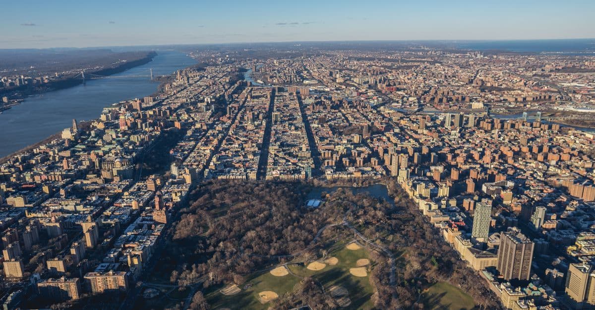 Aerial view of Central Park stretching through the Manhattan skyline, a highlight of any New York City afternoon
