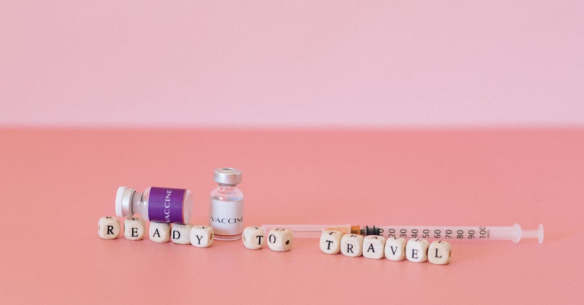 Vaccine vials and syringe with Ready to Travel label showing essential travel vaccinations before departure
