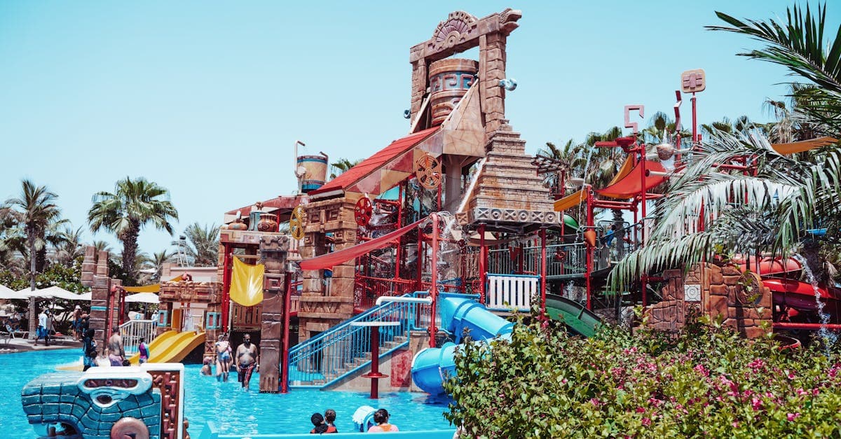 Visitors enjoying thrilling waterslides at a Dubai water park, perfect for families visiting in cooler months
