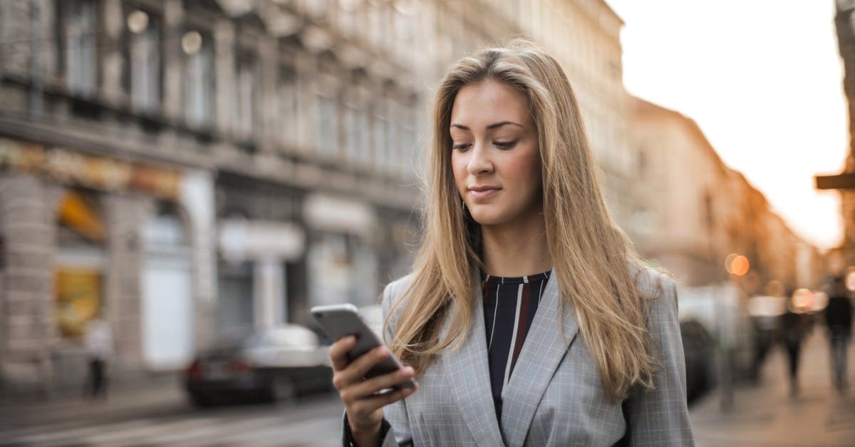 Businesswoman staying connected on a busy city street thanks to a reliable Europe travel eSIM plan.