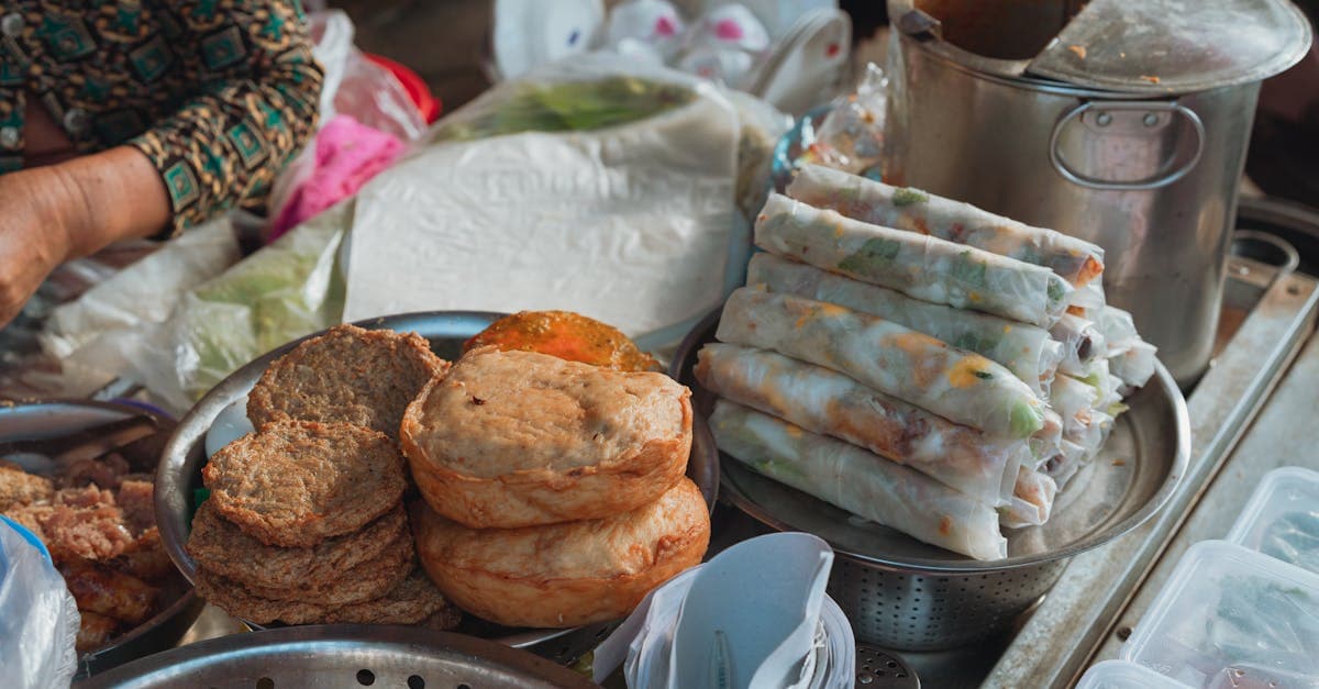 Fresh spring rolls and savoury snacks representing affordable vietnamese street foods at Bình Thuận market
