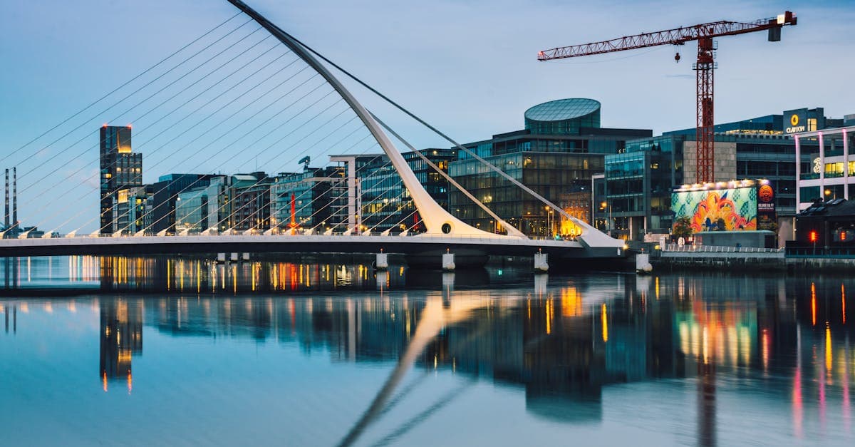 Samuel Beckett Bridge and Dublin skyline at twilight, close to Dublin Airport's cheap flight routes