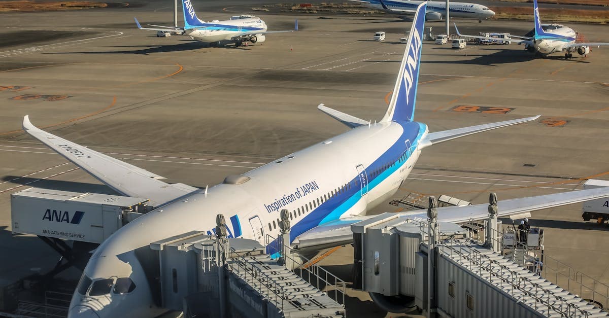 International aircraft connected to a jet bridge at the terminal, illustrating the cost of flights to Japan in AUD