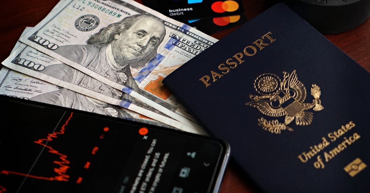 US passport with cash, credit cards, and smartphone illustrating the step-by-step us visa appointment booking process