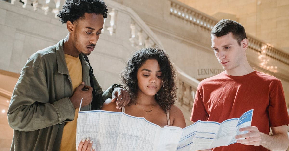 Group of tourists consulting a map at Grand Central Station, weighing whether an esim japan is worth it.