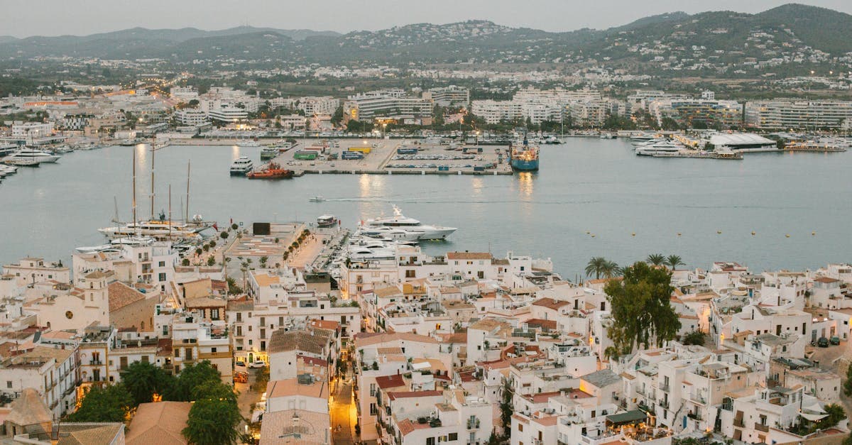 Ibiza's vibrant harbour filled with yachts and waterfront buildings, a welcoming sight after flights to Ibiza from the UK