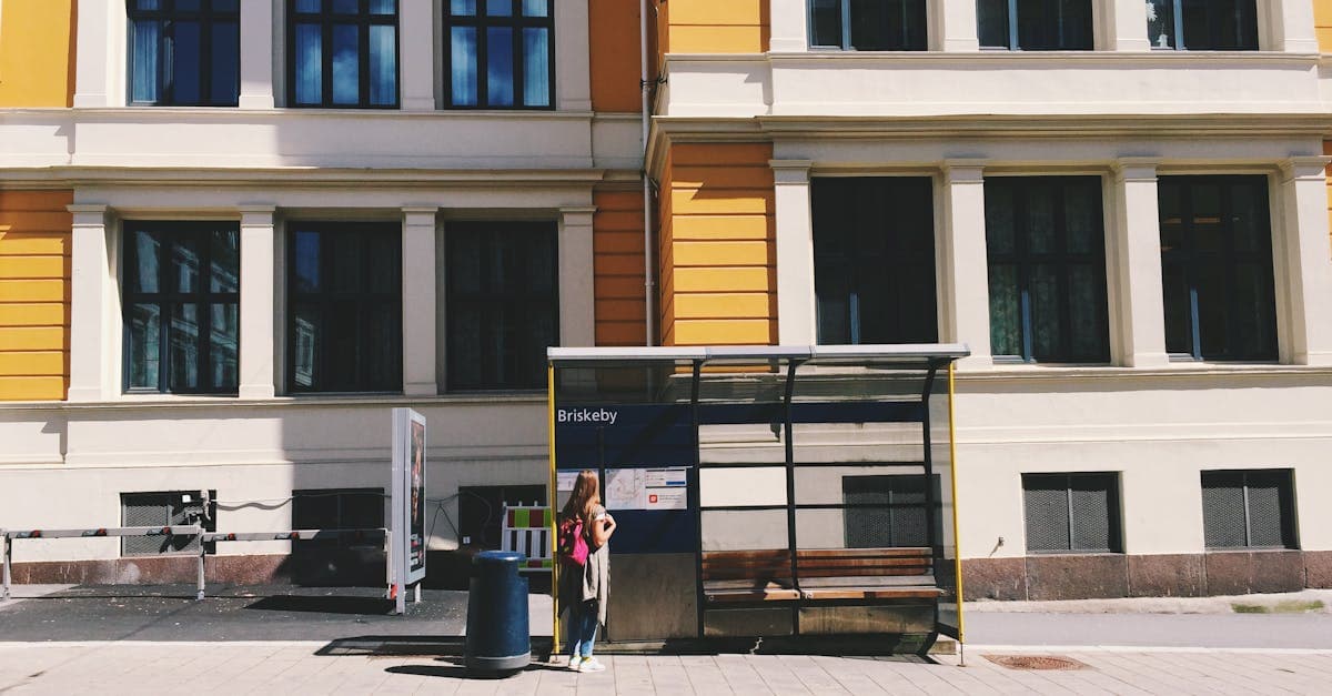 Woman with backpack at Oslo bus stop showing affordable public transport options for budget travel europe