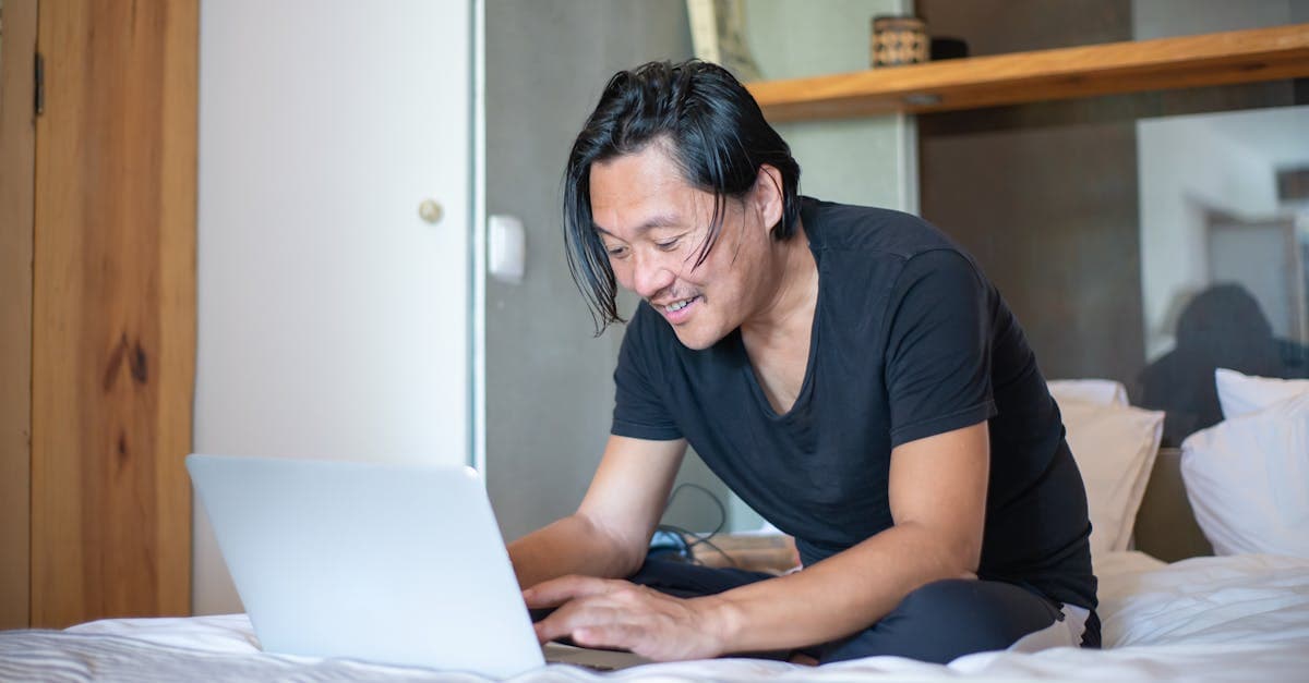Man working from home on a laptop, enjoying a reliable and fast Vodafone broadband internet connection.