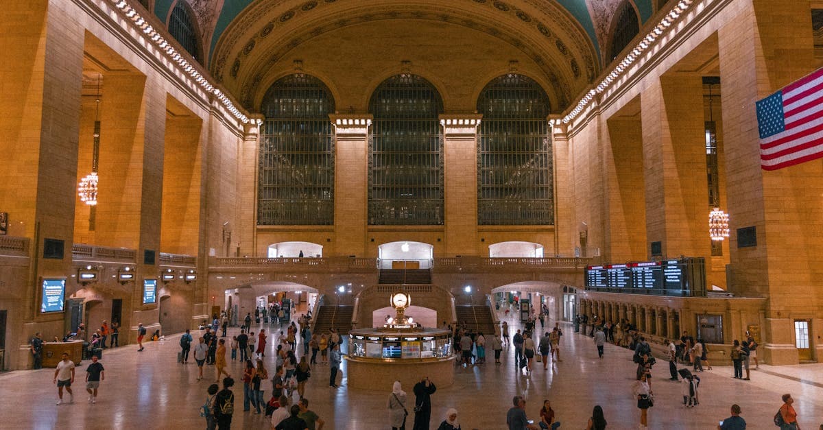 Visitors exploring the grand vaulted interior of Grand Central Terminal, one of Manhattan's most iconic landmarks