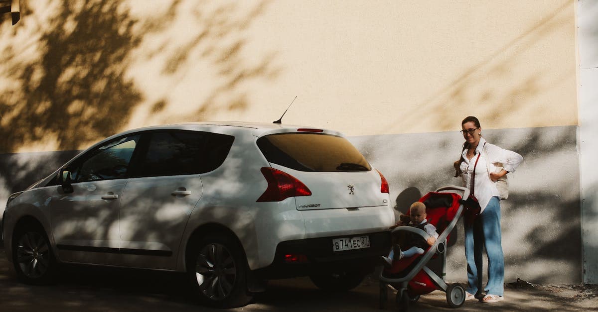 Mother and young child beside a car, checking a travel stroller's recline and canopy settings