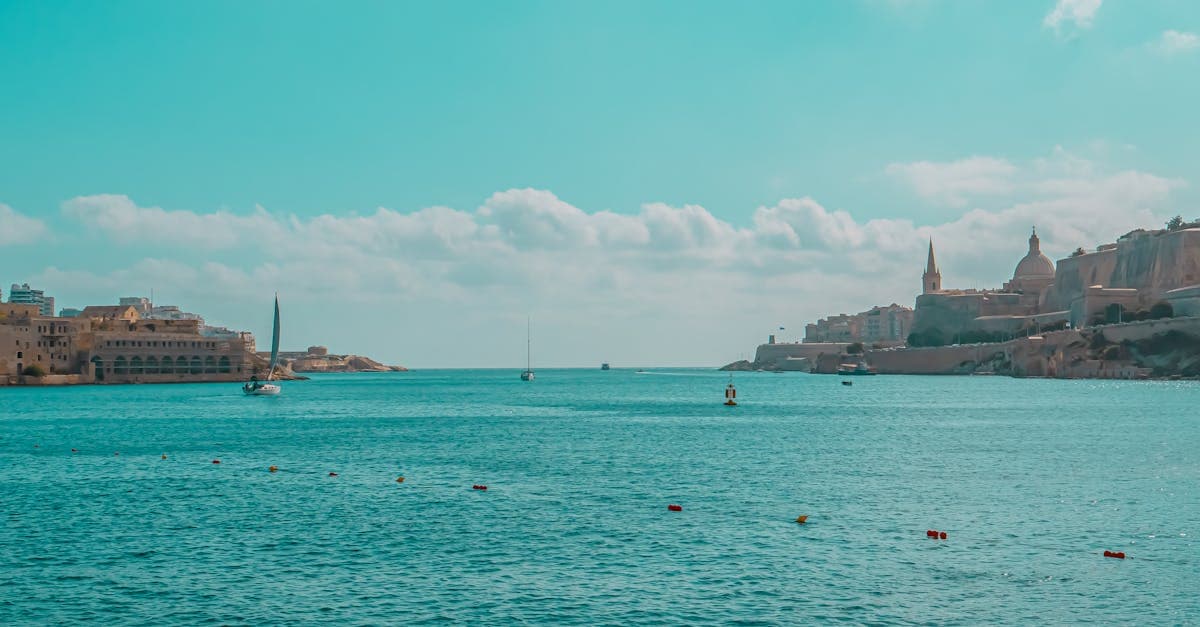 Tranquil seascape showcasing Malta's stunning historic harbor with vibrant blue waters.