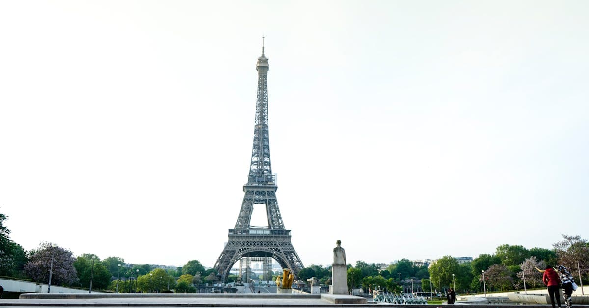 Eiffel Tower rising against a bright Paris sky with few crowds, perfect for staying connected with a travel eSIM