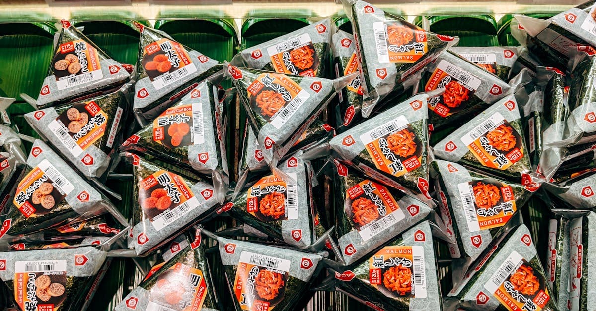 Shelves of onigiri rice balls at a Japanese convenience store, a must-try konbini food experience