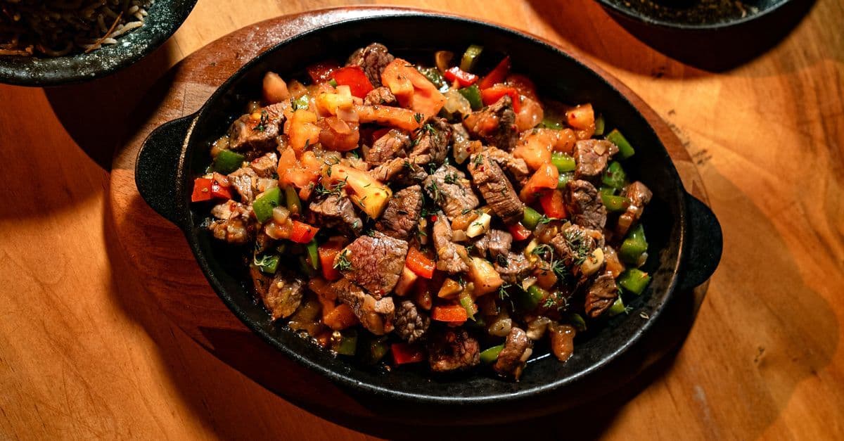 Sizzling Iron Skillet beef with peppers and tomatoes served at a Petro Travel Center restaurant.