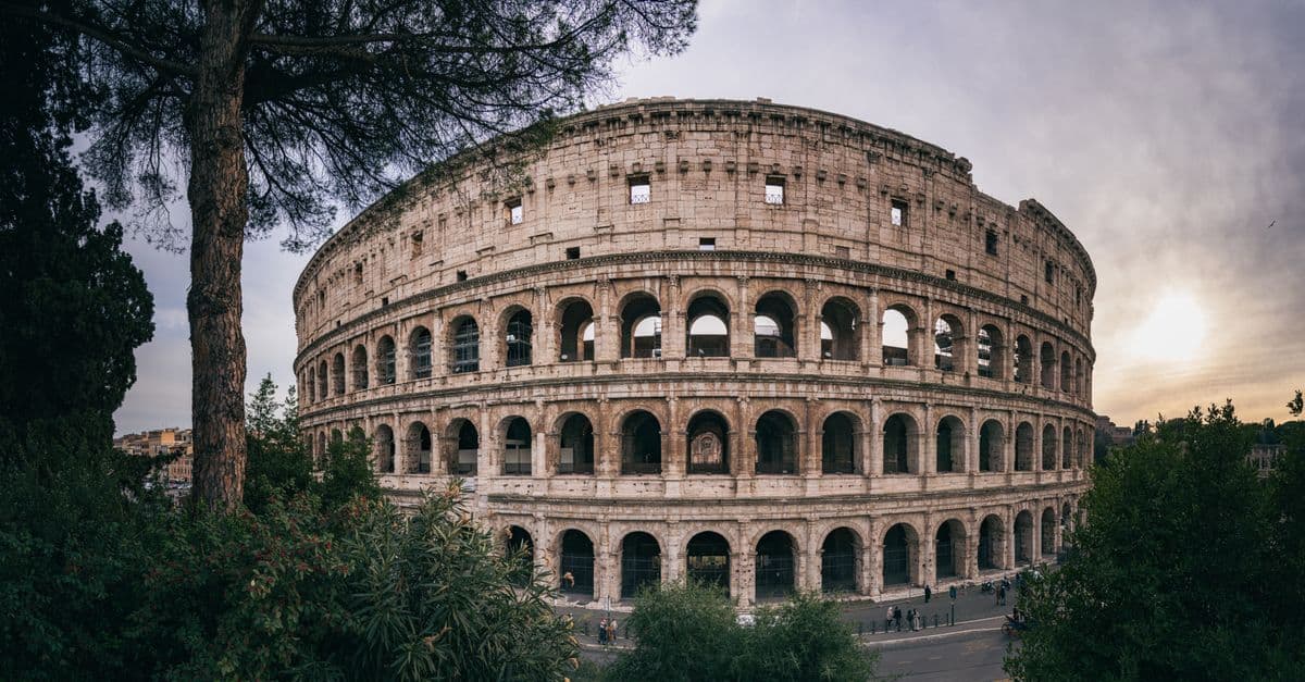 Golden sunset illuminating the Colosseum, one of the most iconic things to do in Rome's ancient heart