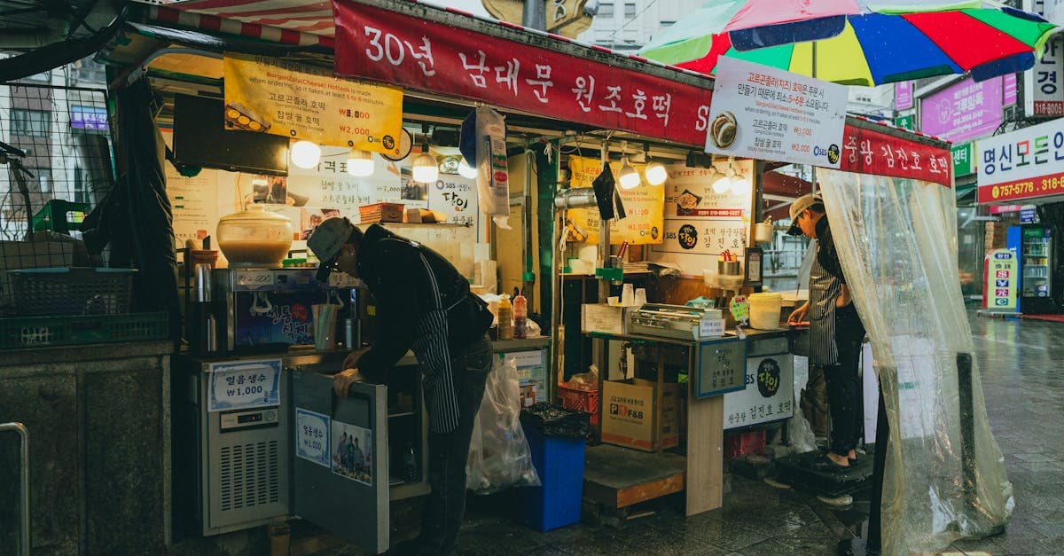 Traditional Korean street food stall with vendors in Seoul, displaying authentic snacks and culinary heritage.