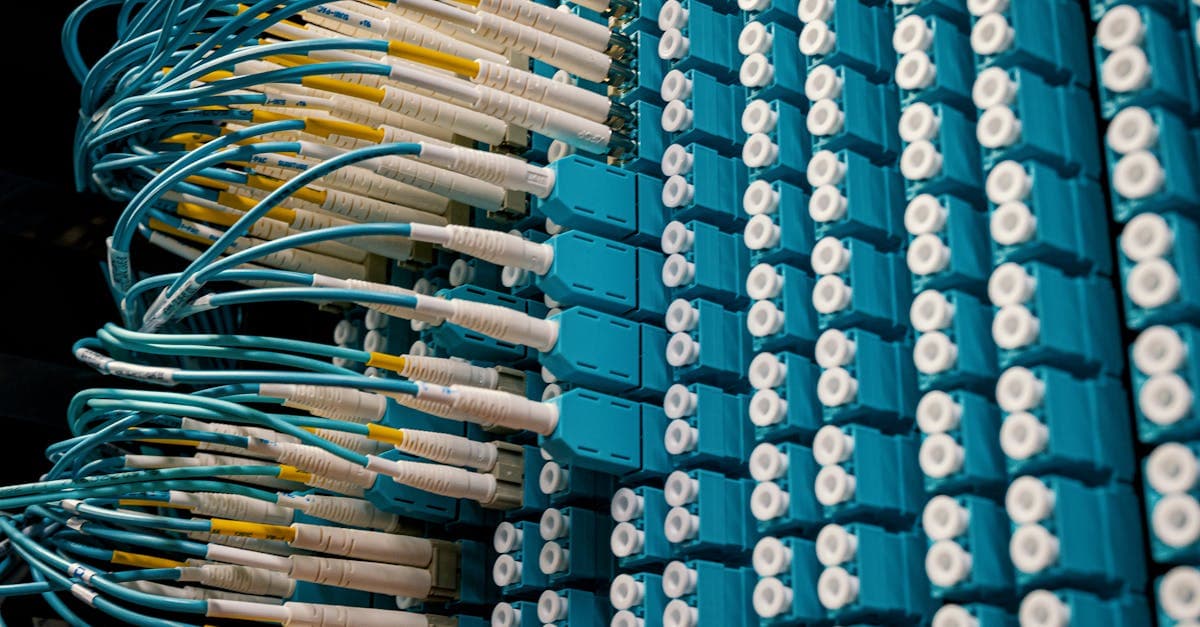Colourful fibre optic cables and round sockets representing the high-speed Vodafone broadband plans available in 2026.