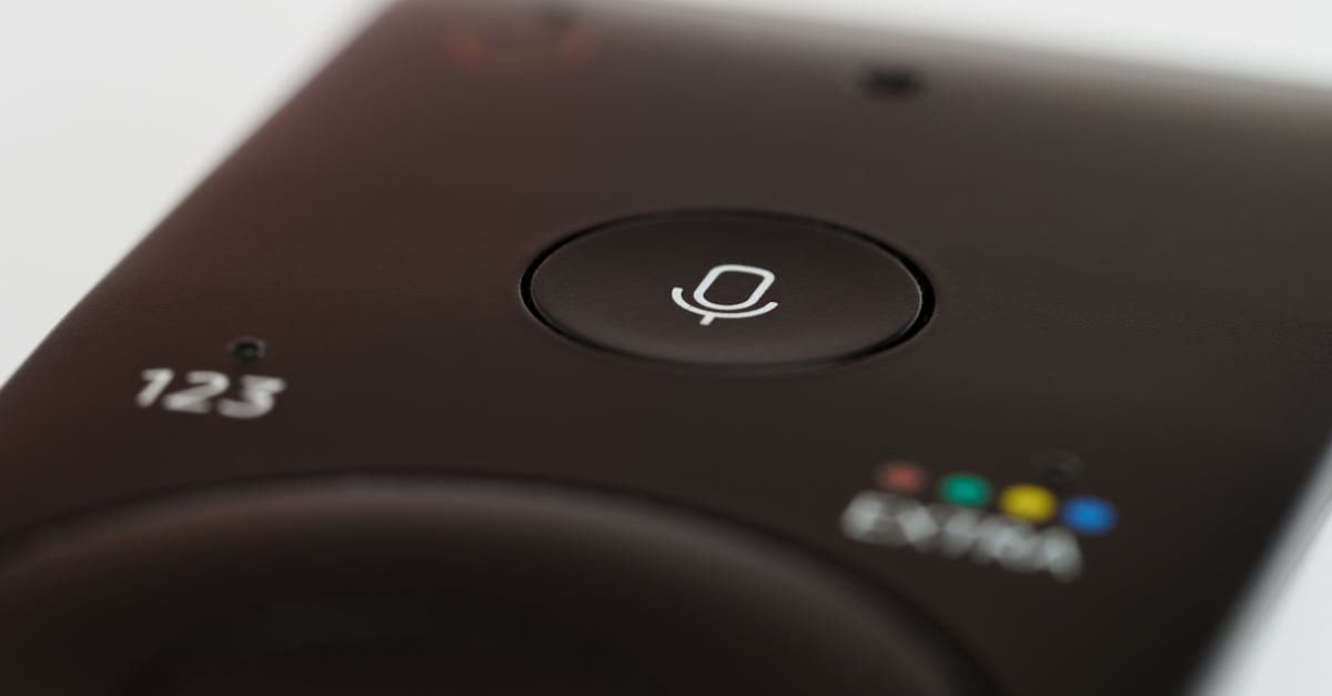 Remote control with microphone button demonstrating how to set up Hey Siri voice recognition