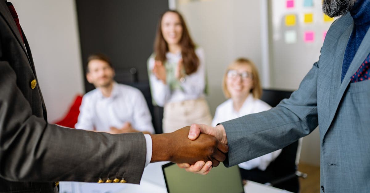 Business partners shaking hands at a Petro Travel Center corporate office, symbolizing ownership and partnership.