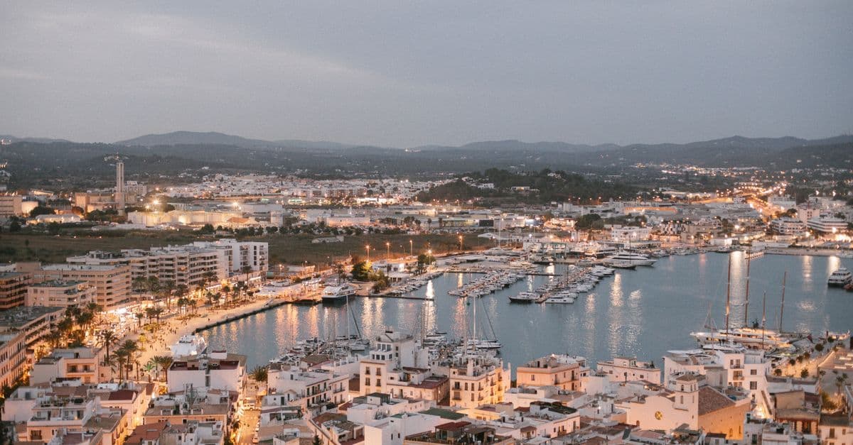Aerial view of Ibiza's marina at dusk, a popular destination for UK flights to Ibiza.
