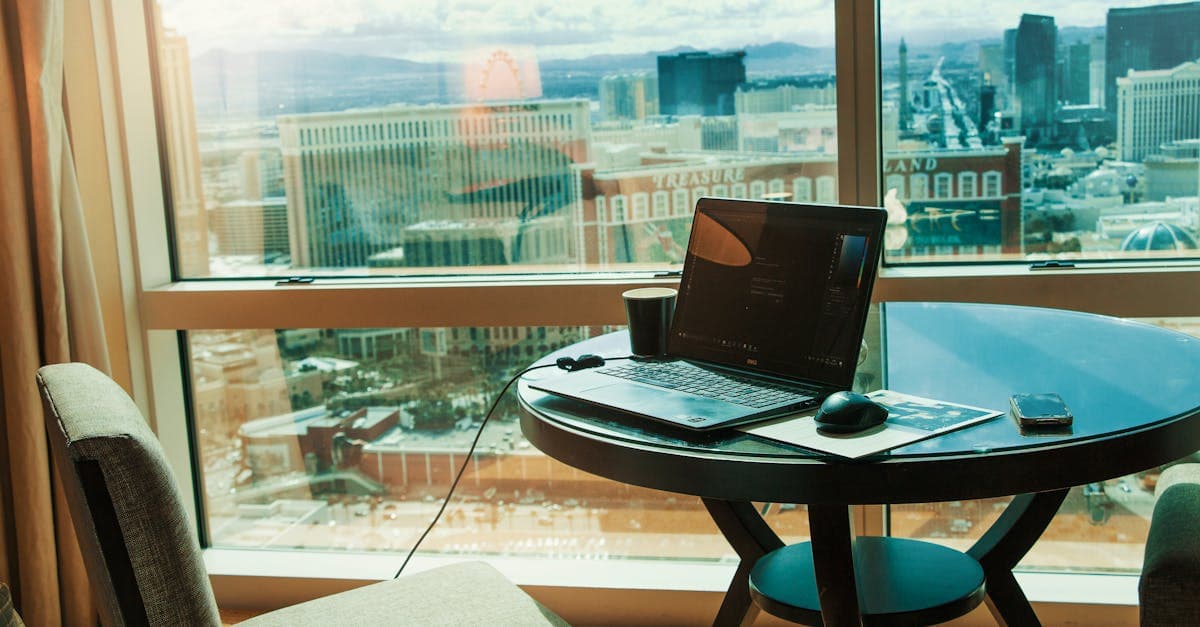 Remote worker at a high-rise workspace with city skyline views, enjoying tax benefits under Spain's Beckham Law