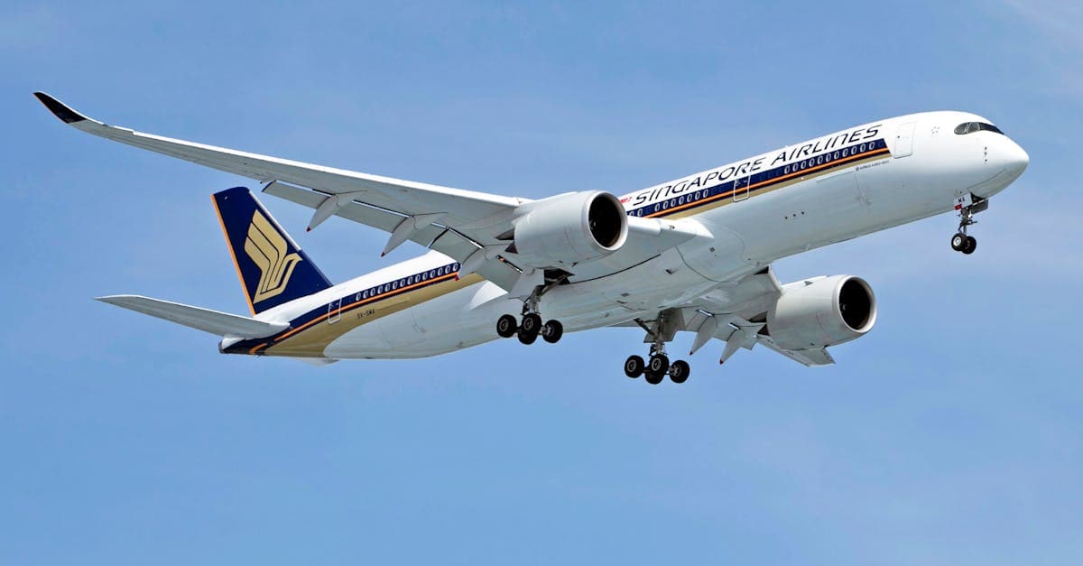 Singapore Airlines Airbus A350 under clear blue sky, one of the main carriers on the Sydney to Singapore route.