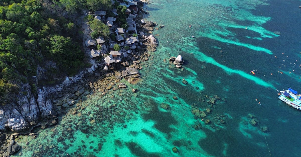 Shark Bay's crystal-clear turquoise waters and dramatic rocky coastline in Ko Tao, included in thailand holiday packages.