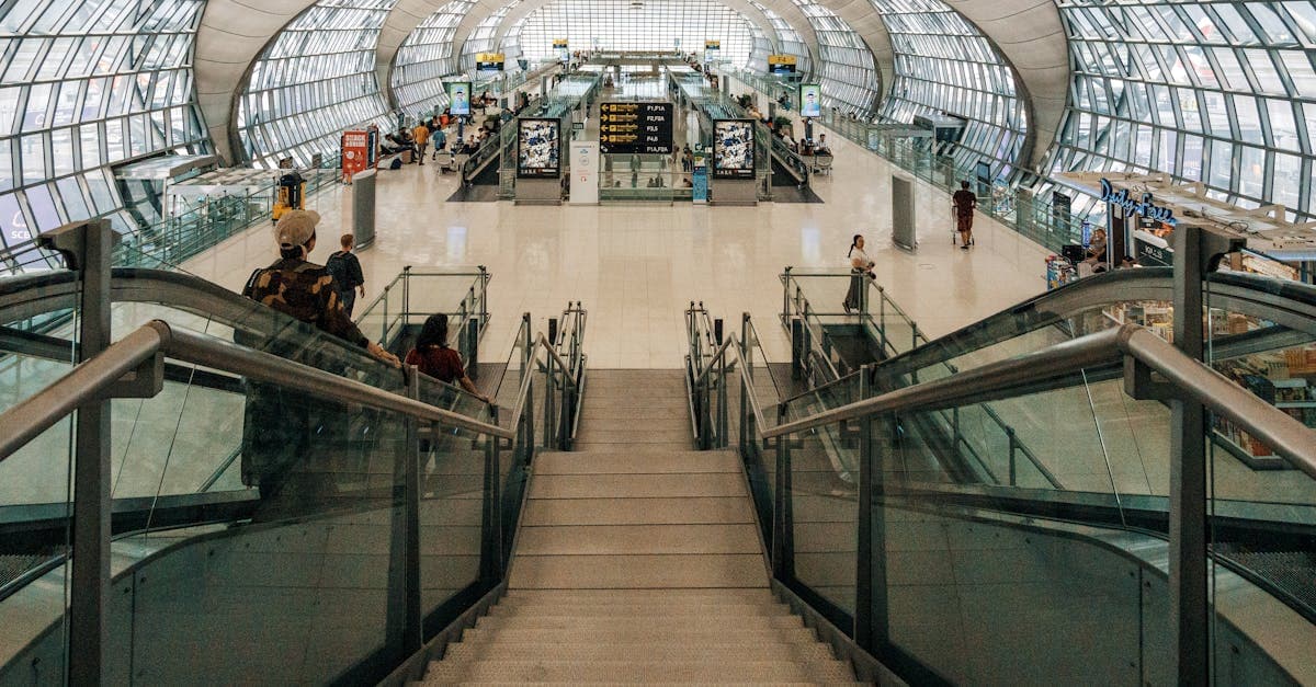 Spacious glass-dome airport terminal where travellers complete the malaysia arrival card step by step![image