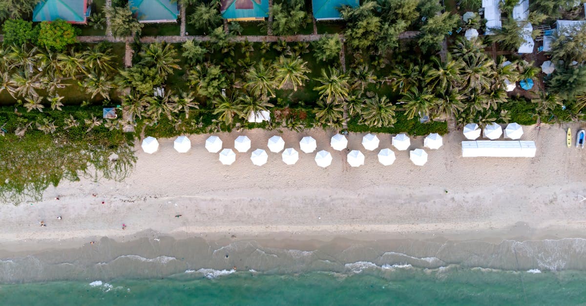 Aerial view of a pristine tropical beach and resort villas, among the cheapest holiday destinations from Ireland