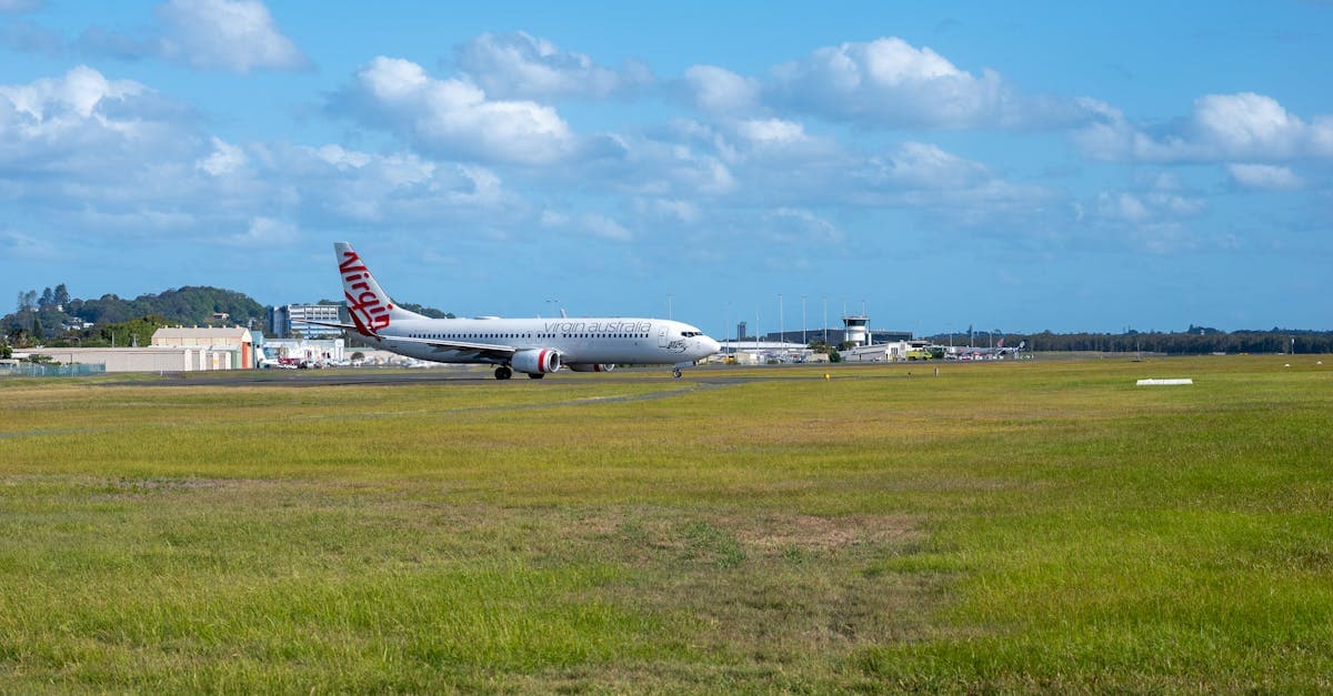 Virgin aircraft on the runway at Gold Coast Airport under a clear blue sky