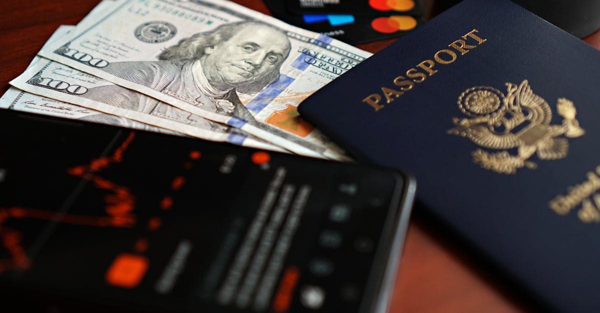 Passport, US dollars, and credit cards arranged for budgeting T-Mobile international roaming fees before travel.