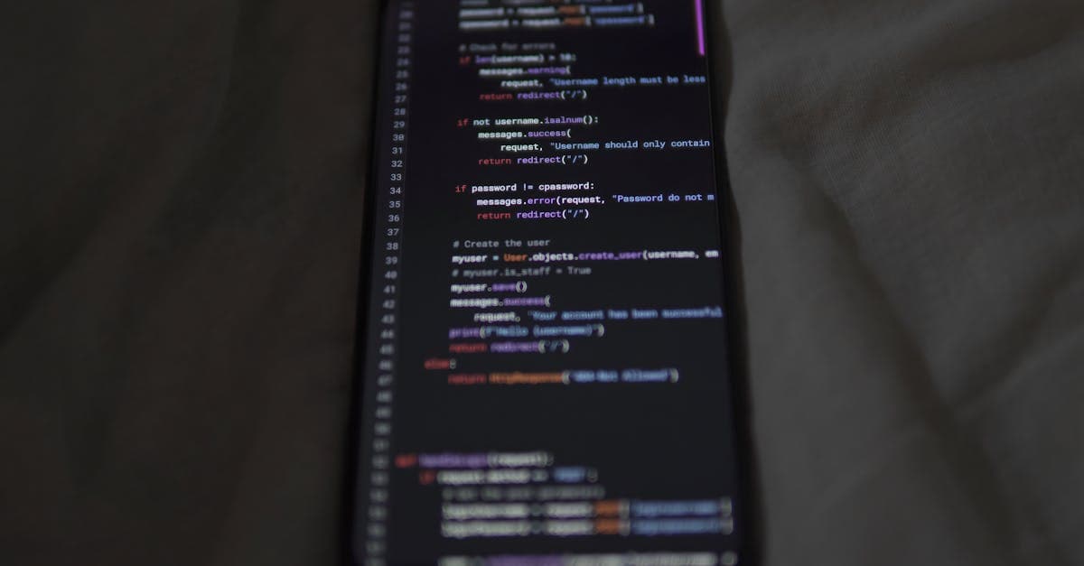 Google Apps Scriptで実現できる自動化を示す、スマートフォン画面に表示されたプログラミングコードのクローズアップ