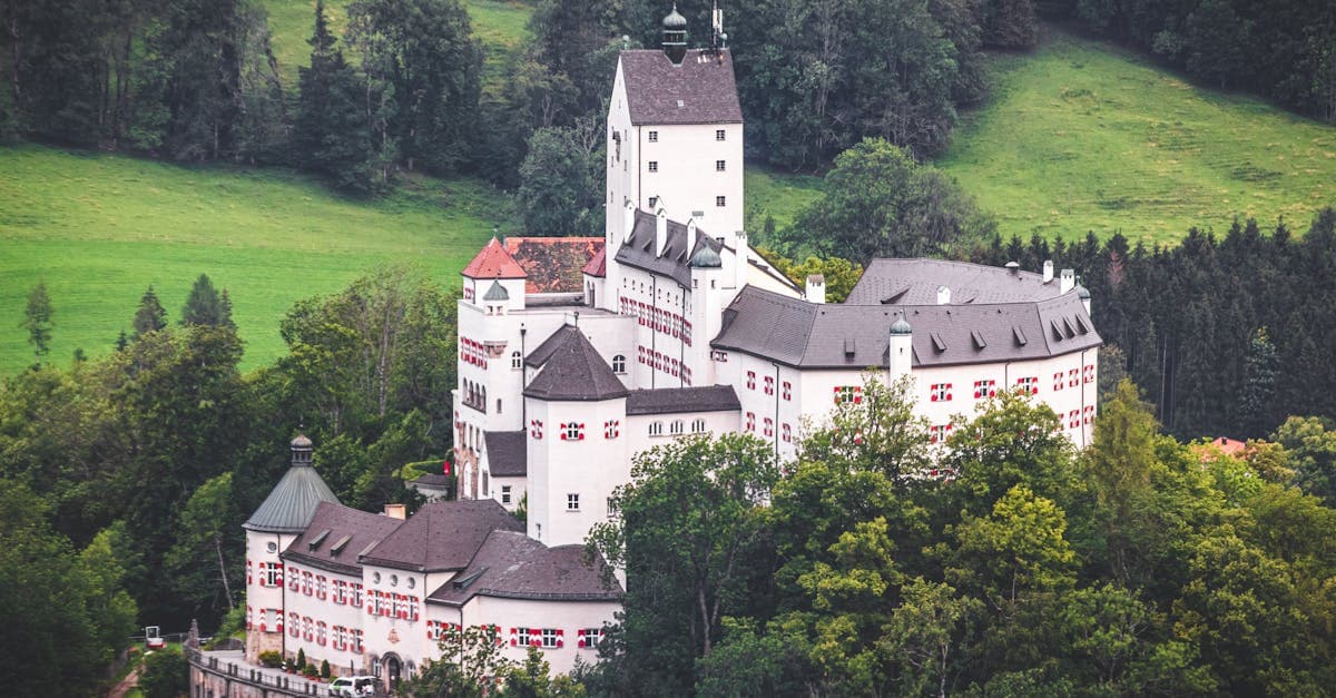 Aerial view of Hohenaschau Castle nestled in the lush Bavarian countryside, Germany.