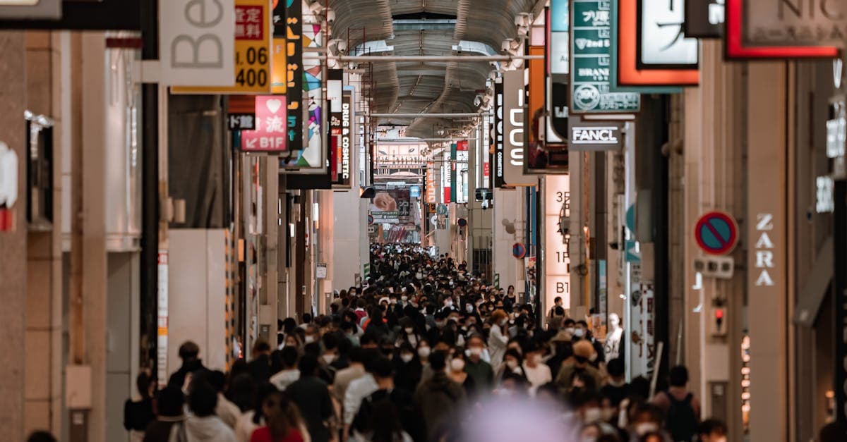Shoppers on Osaka's covered shopping street, where you can keep your NZ number active alongside an eSIM Japan