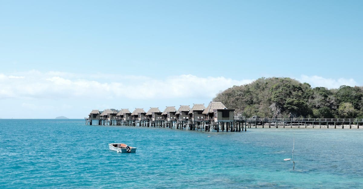 Overwater bungalows in Fiji with a calm ocean view, reflecting the cost range of fiji holiday packages