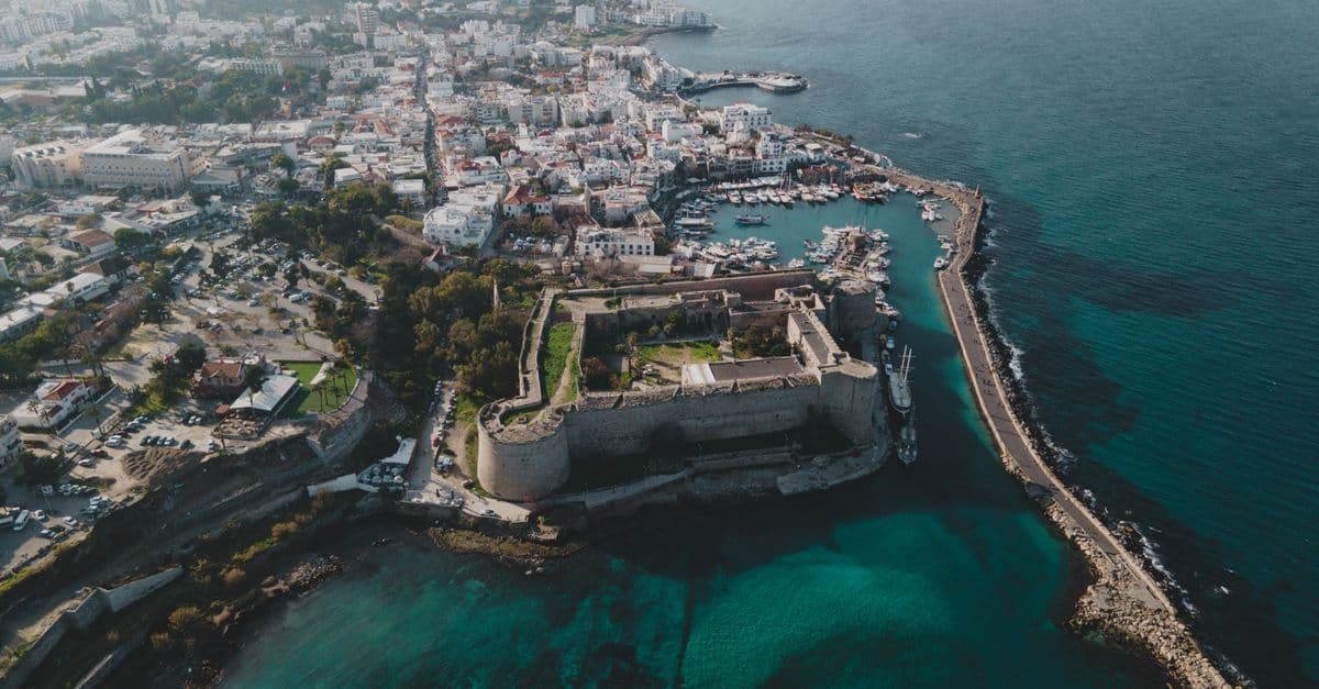 Historic coastal fortress overlooking a divided city's waterfront, symbolizing Cyprus's split between north and south