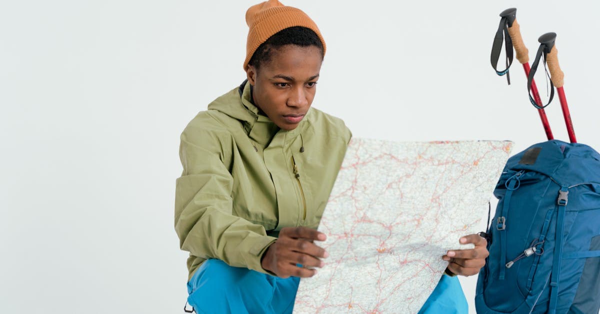 Backpacker studying a map while planning the perfect first solo trip as a woman