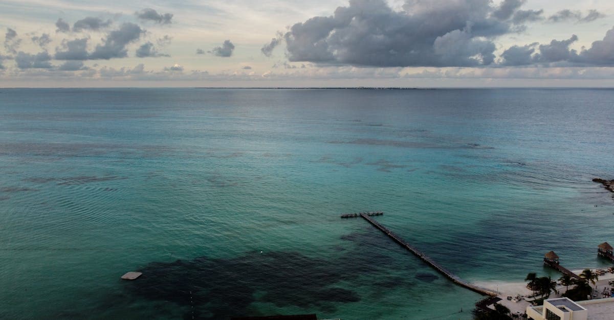 Drone view of a Caribbean pier in Cancun during hurricane season, a caution period for visitors