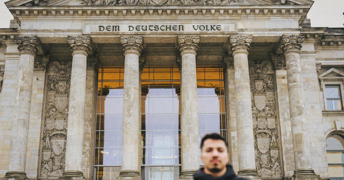 Front view of tourist at the historic Reichstag Building in Berlin, Germany.